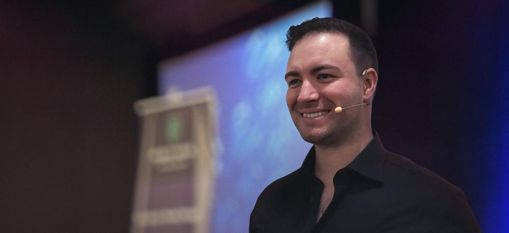 Ronnie Osborne presenting on stage